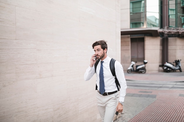 Young man talking on smartphone