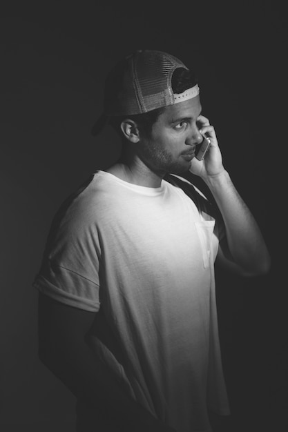 Young man talking on telephone