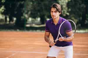 Free photo young man tennis player at the court