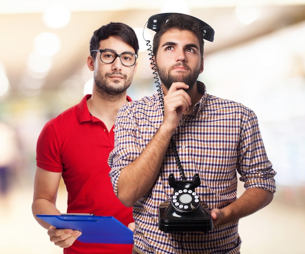 young man thinking telephone