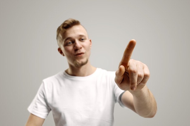 Free photo young man touching empty space