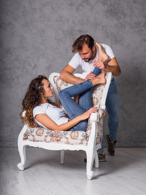 Young man touching woman feet