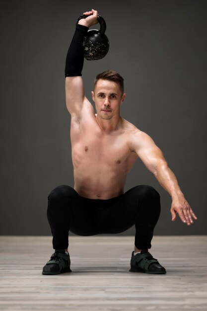 Young man training with weights