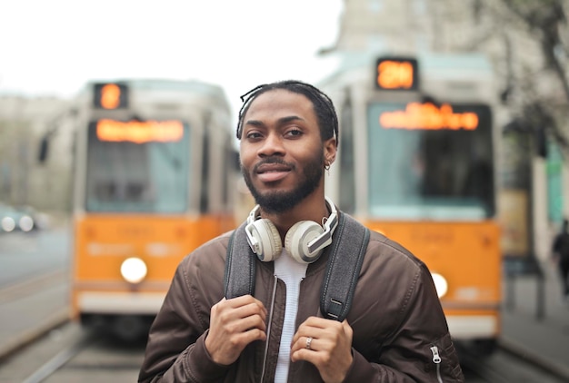 young man in a tram station in the city