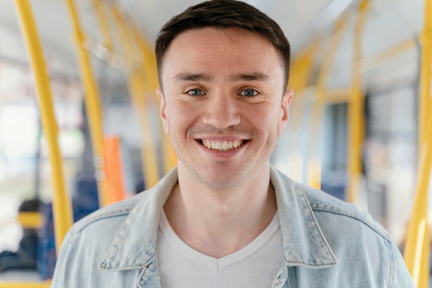 Young man travelling by city bus