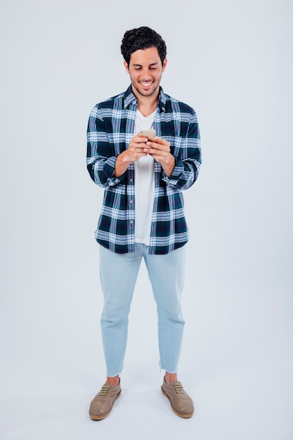 Young man typing on smartphone