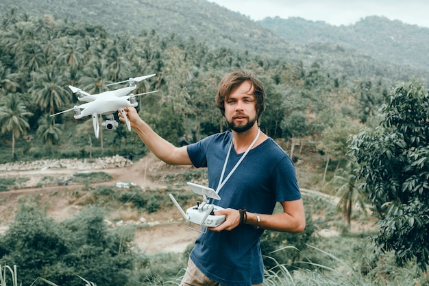 young man uses dron,  