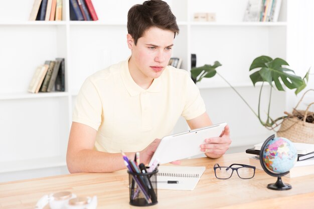 Young man using digital tablet