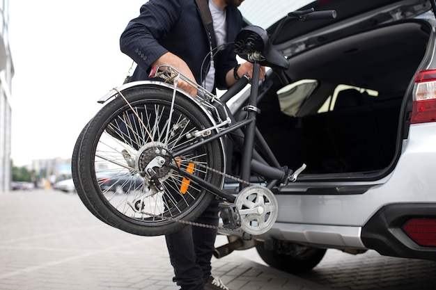 Young man using a folding bike in the city