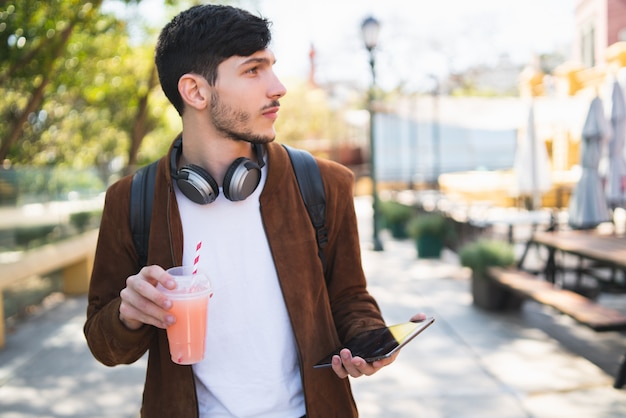 Young man using his digital tablet.