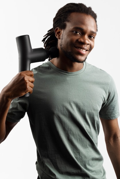 Young man using message gun