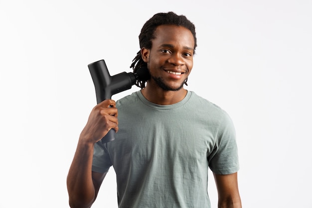 Young man using message gun