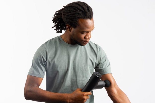 Young man using message gun