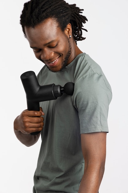 Young man using message gun