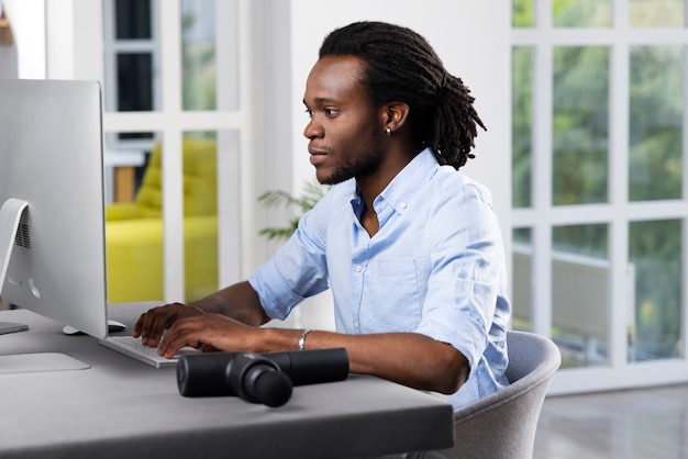 Young man using message gun