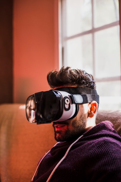 Free photo young man in vr goggles