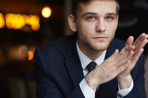 Young Man waiting in Cafe