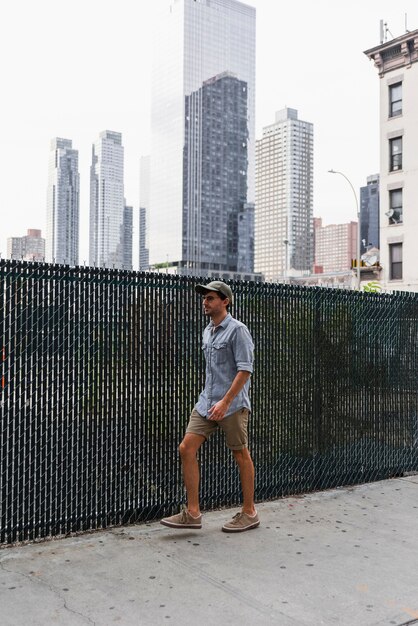 Young man walking on a paved street