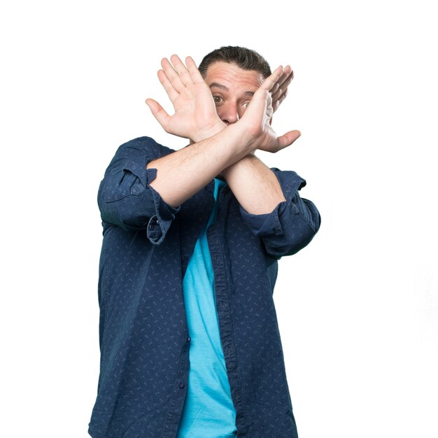 Young man wearing a blue outfit. Looking scared.