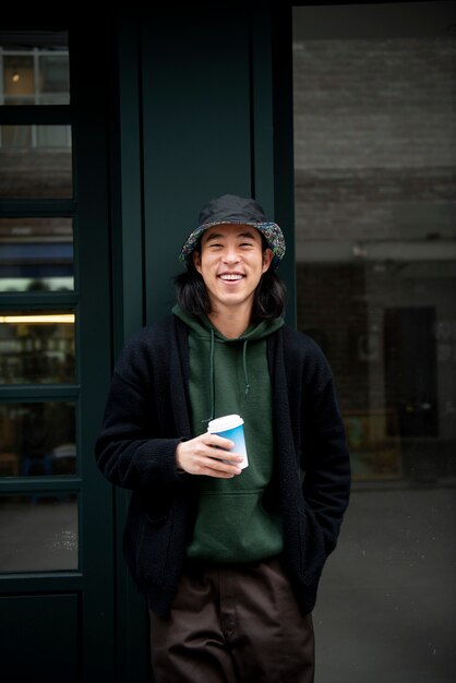 Young man wearing a bucket hat in the city