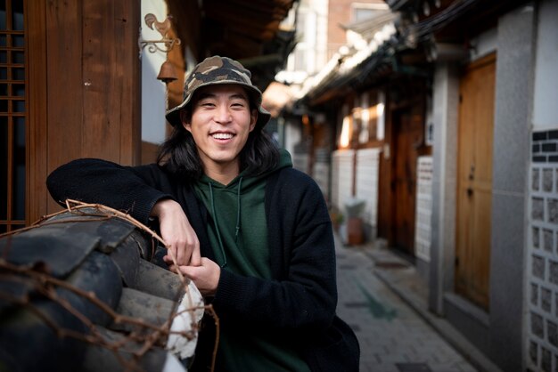 Young man wearing a bucket hat in the city