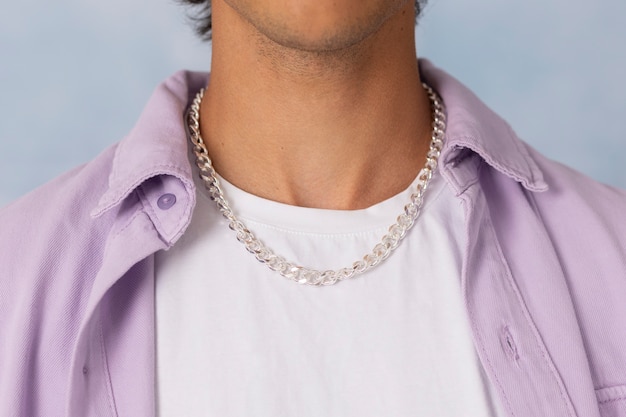 Young man wearing chain necklace