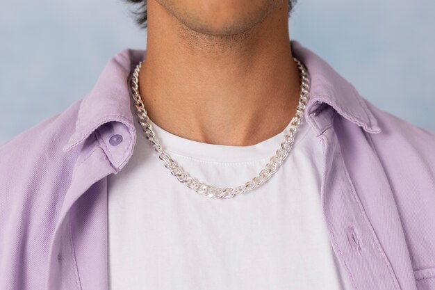 Young man wearing chain necklace