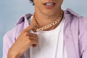 Free photo young man wearing chain necklace