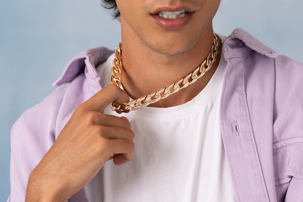 Young man wearing chain necklace