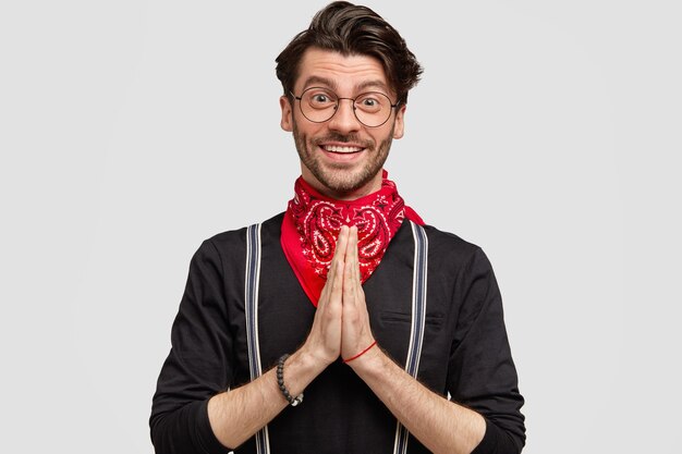 Young man wearing red bandana and black shirt