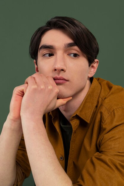 Young man wearing shirt posing