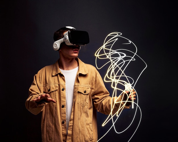 Young man wearing virtual reality goggles