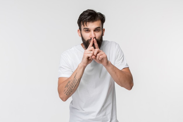 The young man whispering a secret behind her hand