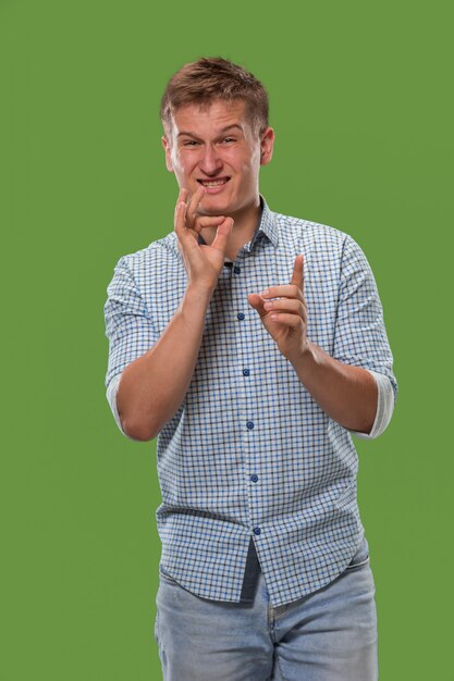 The young man whispering a secret behind his hand