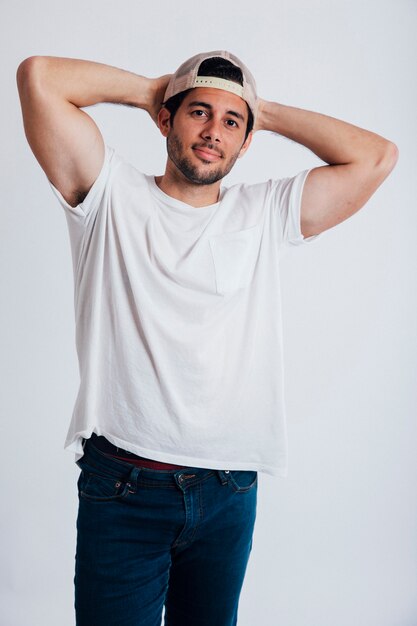 young man with arms behind head