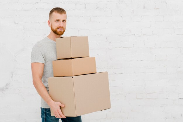 Young man with carton boxes