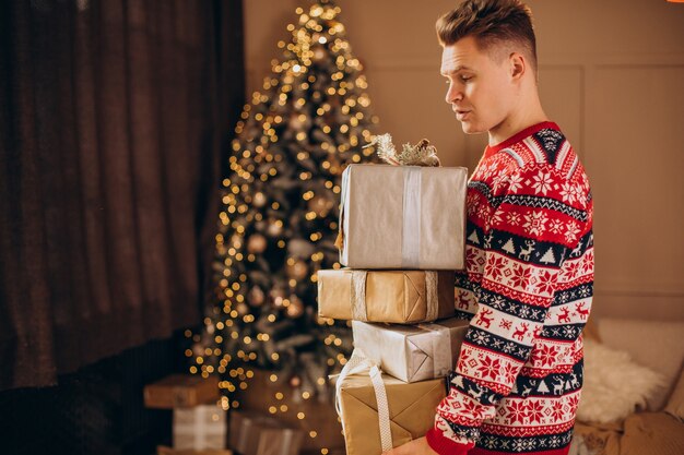 Young man with Christmas presents