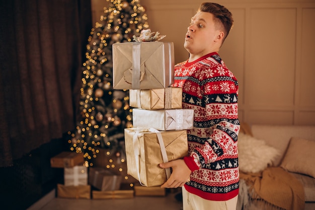 Young man with christmas presents