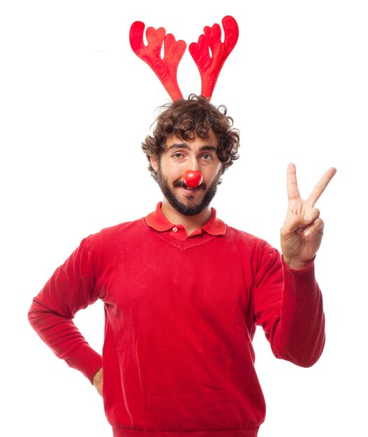 Free photo young man with clown nose and positive gesture