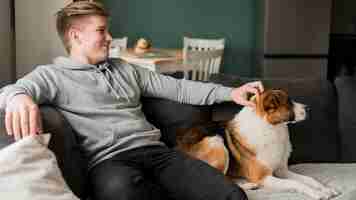 Free photo young man with dog