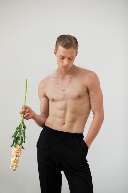 Free photo young man with flower front view