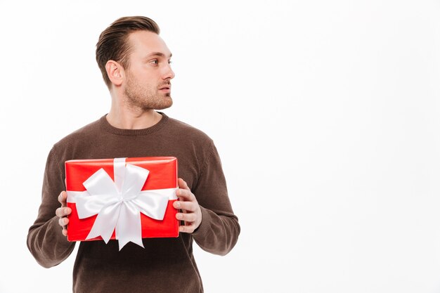 Young man with gift box surprise.