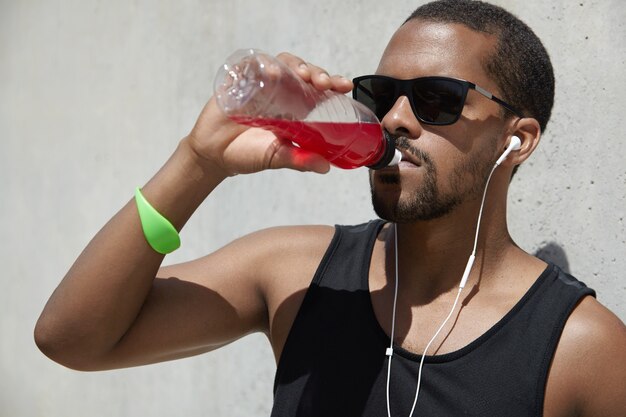 Young man with headphones wearing sportswear