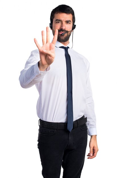 Young man with a headset counting four