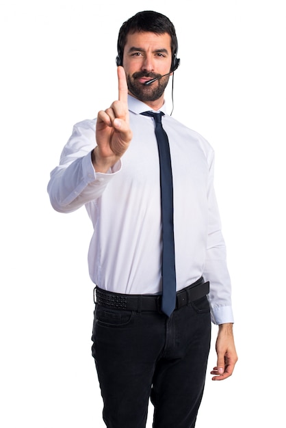 Young man with a headset counting one