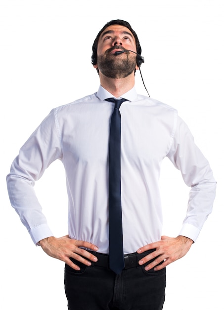 Young man with a headset looking up