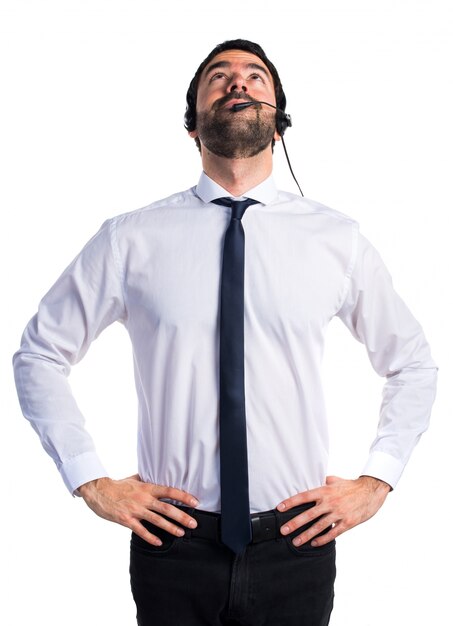 Young man with a headset looking up