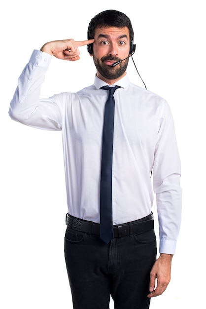 Young man with a headset making crazy gesture