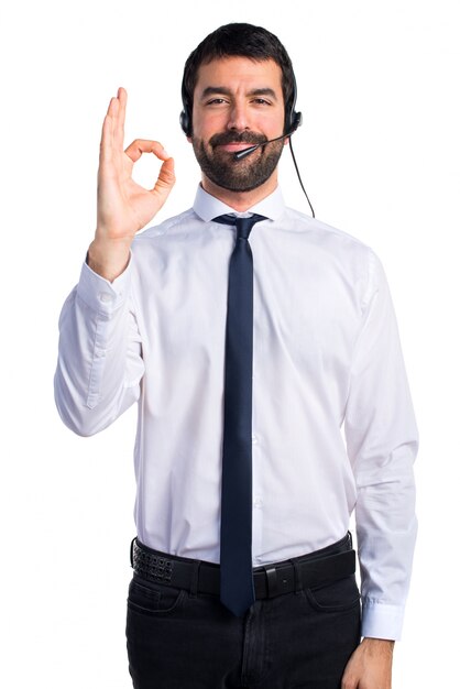 Young man with a headset making OK sign