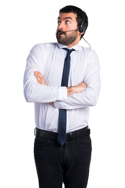 Young man with a headset making unimportant gesture